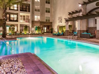 A large swimming pool in front of a building